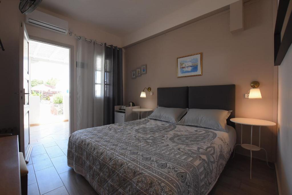 Postel nebo postele na pokoji v ubytování Rodakas Hotel