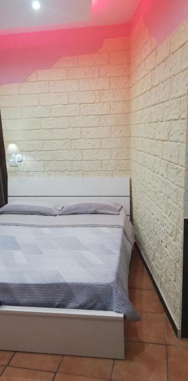 A bed or beds in a room at b&b ERCOLANO Scavi