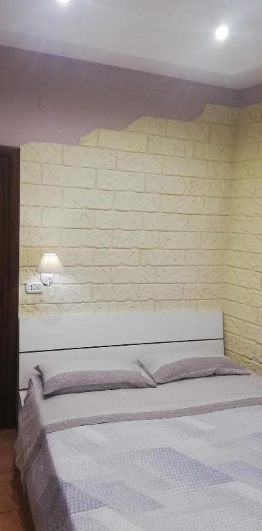A bed or beds in a room at b&b ERCOLANO Scavi