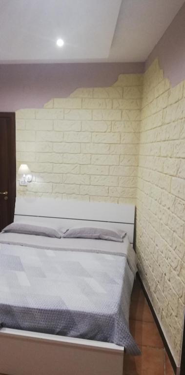 A bed or beds in a room at b&b ERCOLANO Scavi