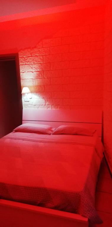 A bed or beds in a room at b&b ERCOLANO Scavi