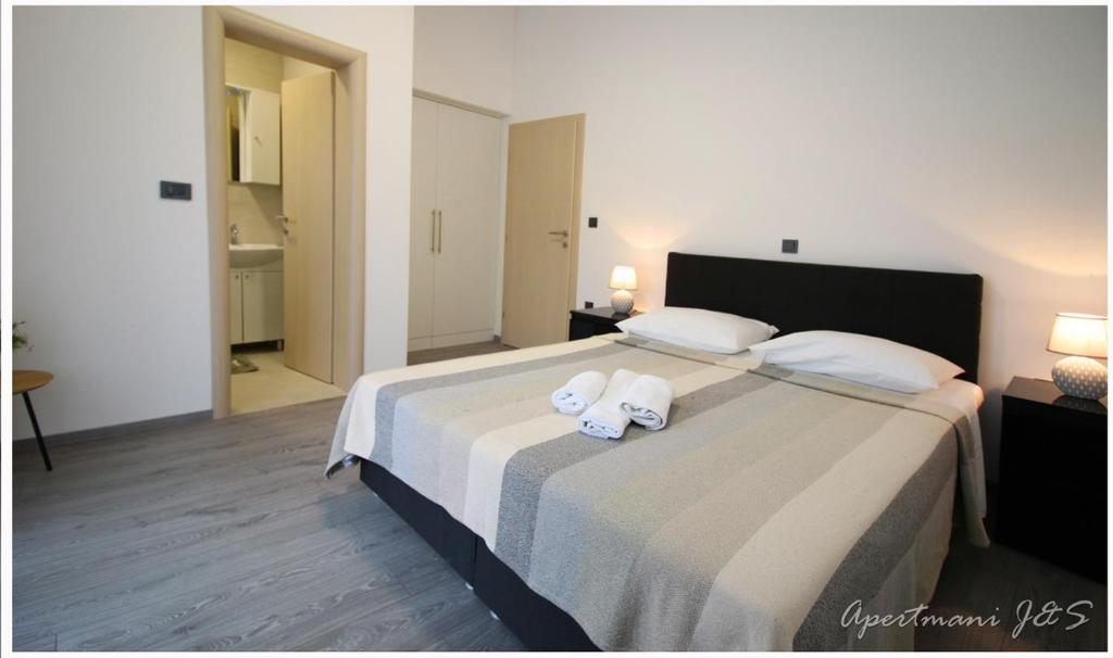 Postel nebo postele na pokoji v ubytování Apartmani Jere&Sara