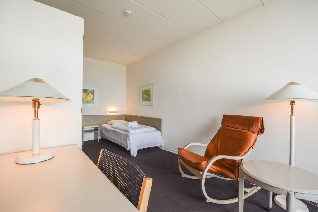 Postel nebo postele na pokoji v ubytování Hotel Østersø