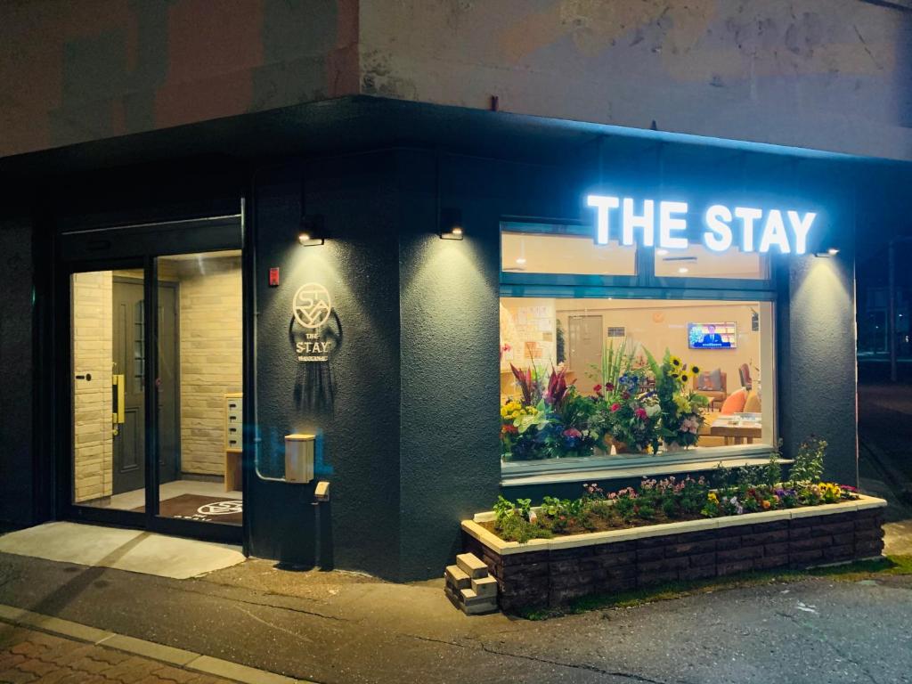 a store front with a sign that reads the stay at THE STAY WAKKANAI in Wakkanai