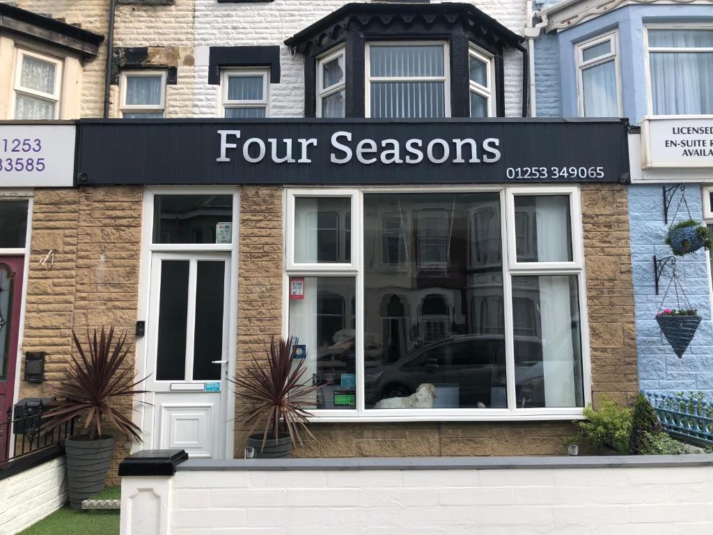a four seasons store on the side of a building at Four Seasons Guest House in Blackpool