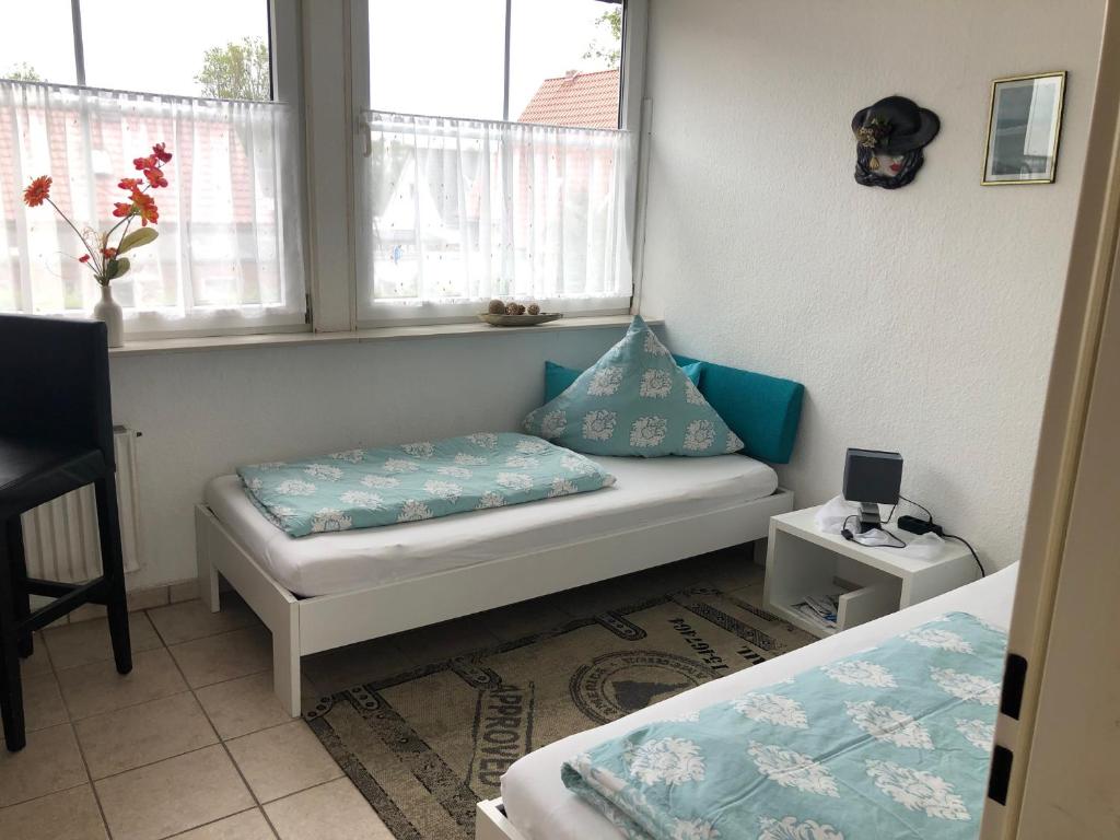 Postel nebo postele na pokoji v ubytování Haus Kormoran Borkum