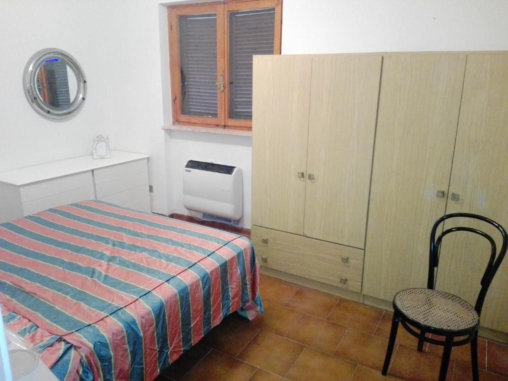Łóżko lub łóżka w pokoju w obiekcie Casa nel Verde