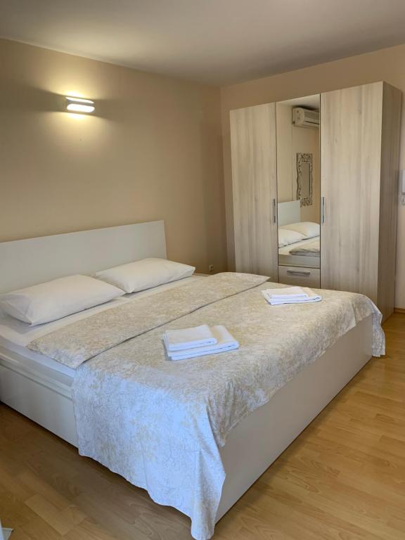 Posteľ alebo postele v izbe v ubytovaní Apartments Villa Ohana