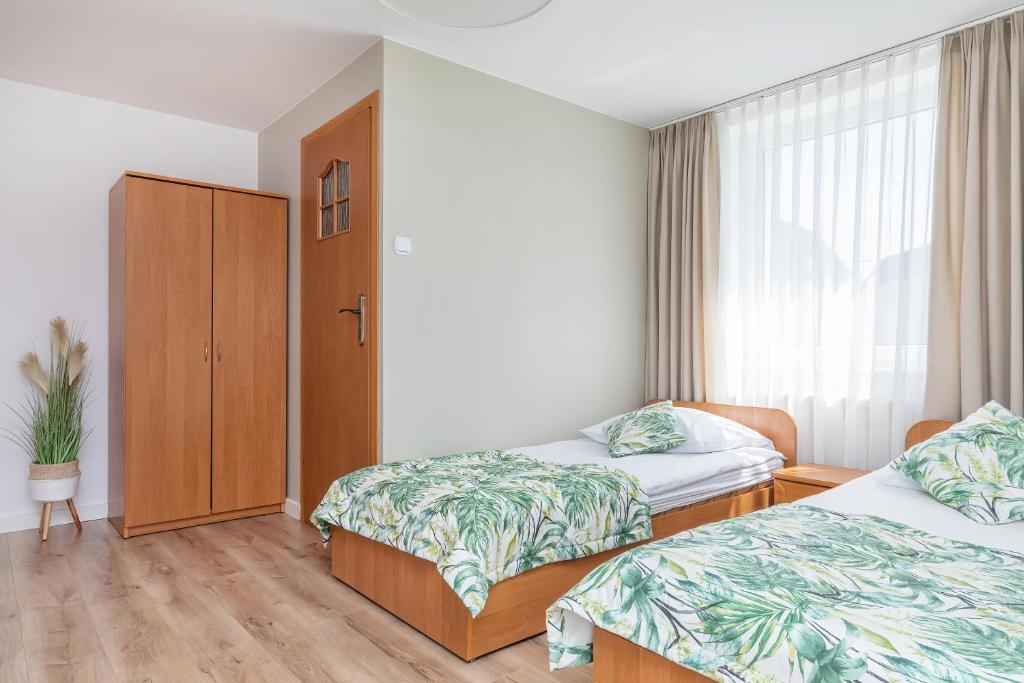 Postel nebo postele na pokoji v ubytování Paula