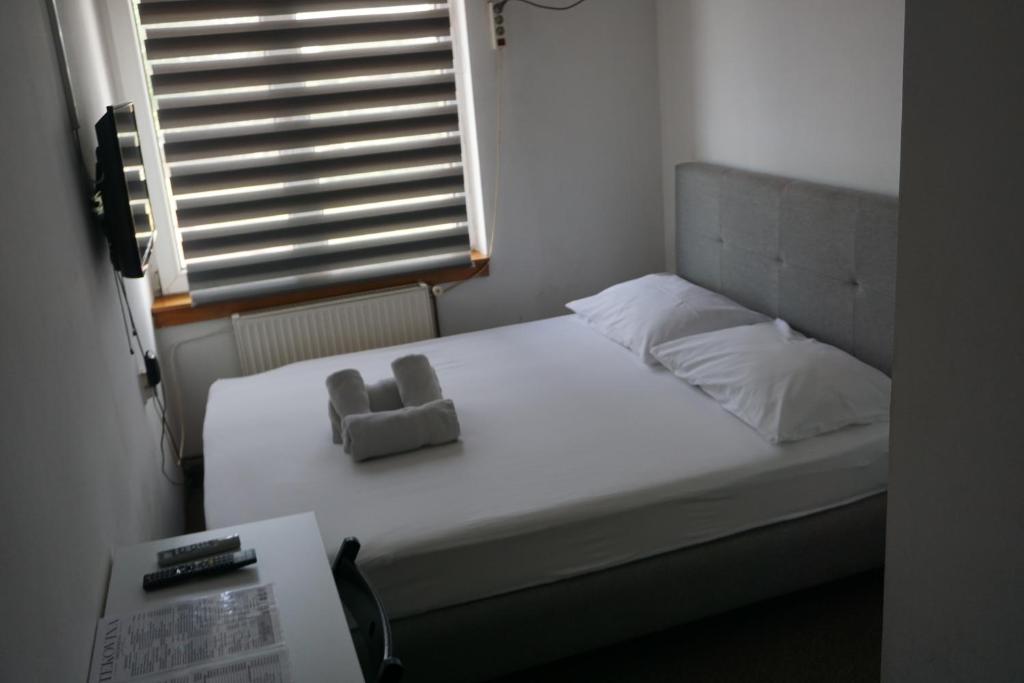 Postel nebo postele na pokoji v ubytování Guesthouse & restaurant Tekovina