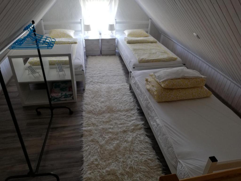 Postel nebo postele na pokoji v ubytování Domek letniskowy u Anki Leba - Charbrowo