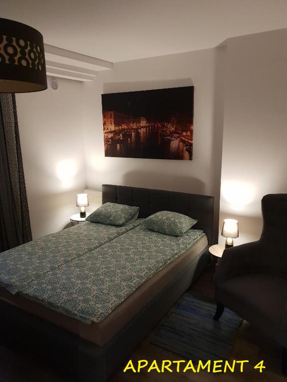 Łóżko lub łóżka w pokoju w obiekcie Apartamenty Amalia