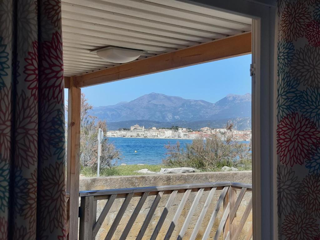 a balcony with a view of the water at U Pezzo in Saint-Florent