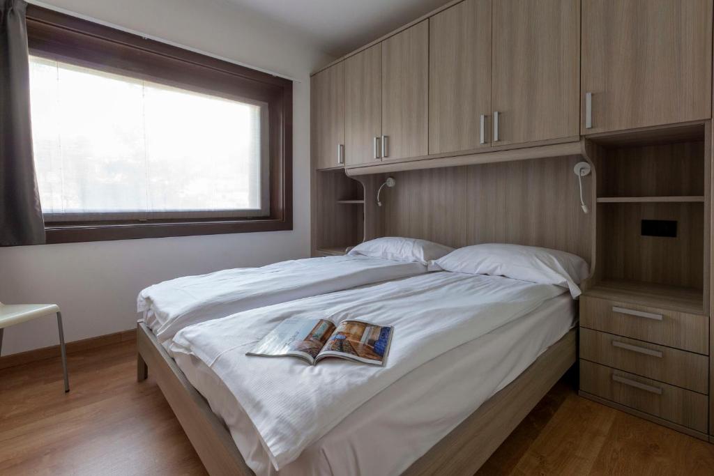 Postel nebo postele na pokoji v ubytování Residence Adele