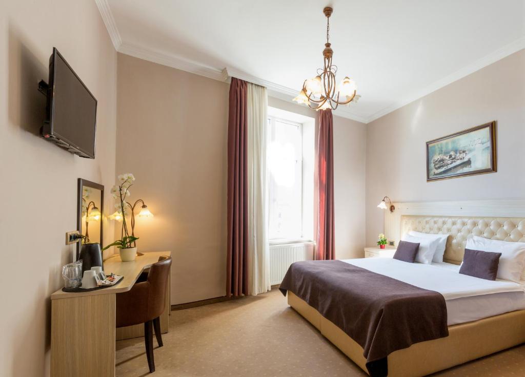 Postel nebo postele na pokoji v ubytování Belgrade City Hotel