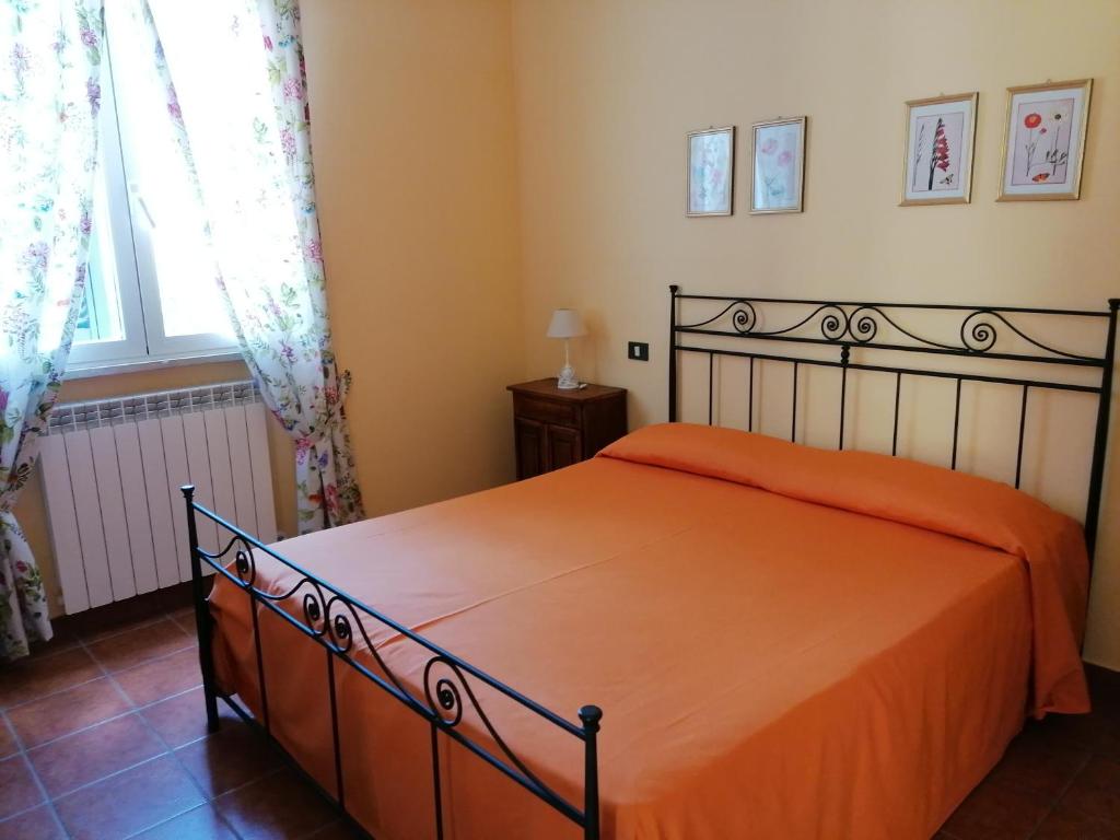 Postel nebo postele na pokoji v ubytování Agriturismo Poggio Sassineri