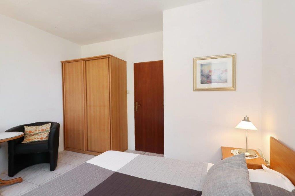 Posteľ alebo postele v izbe v ubytovaní Murter Pod Raduč apartman