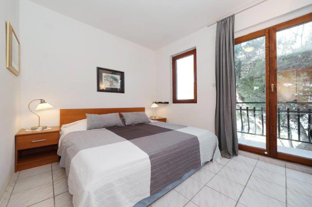 Posteľ alebo postele v izbe v ubytovaní Murter Pod Raduč apartman
