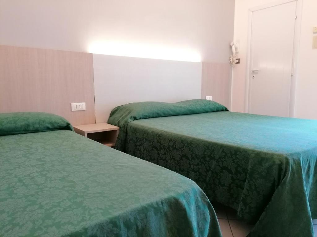 Postel nebo postele na pokoji v ubytování HOTEL ANDREA'S