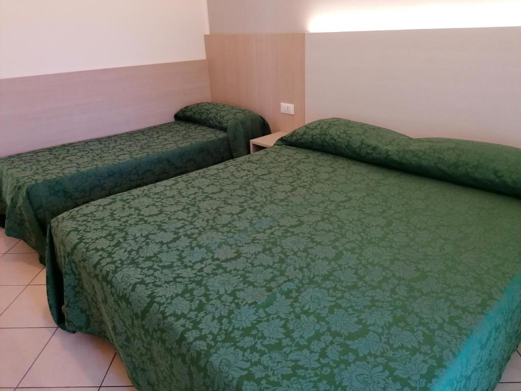 Postel nebo postele na pokoji v ubytování HOTEL ANDREA'S