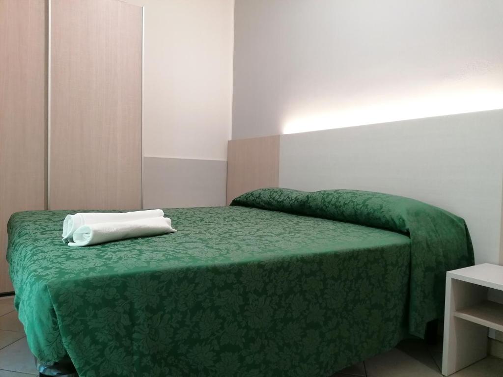Postel nebo postele na pokoji v ubytování HOTEL ANDREA'S