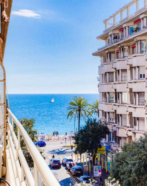 a view of the ocean from a balcony of a building at #29 Suite Gambetta AC Sea view 2 bedrooms 1min Walk to Promenade &amp; Sea in Nice