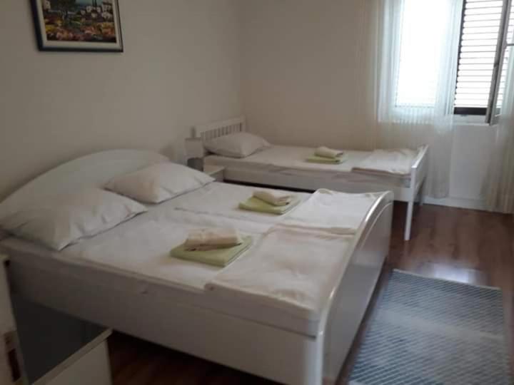 Postel nebo postele na pokoji v ubytování Apartments Verica