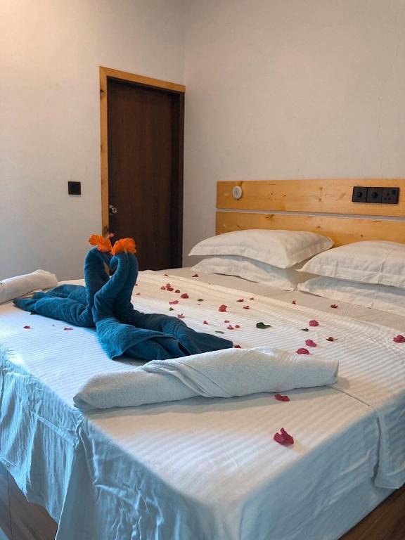 Postel nebo postele na pokoji v ubytování Huvan Inn