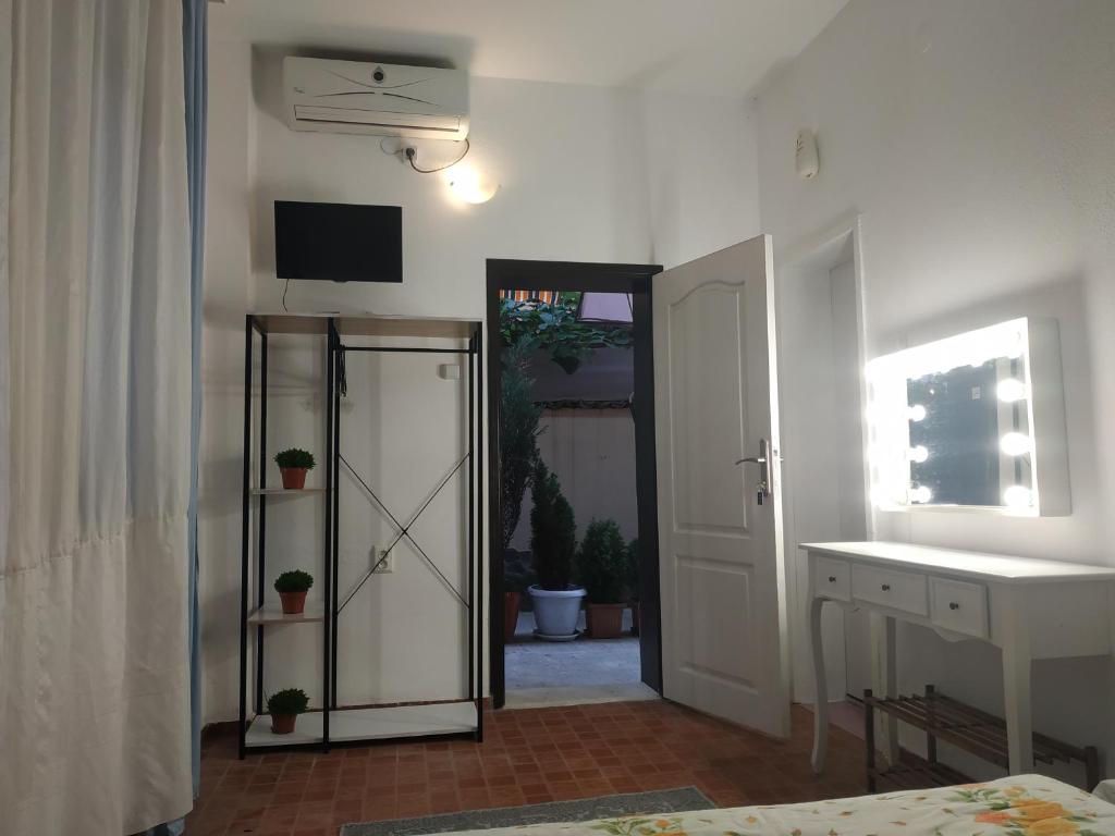 Postel nebo postele na pokoji v ubytování Rali Apartments