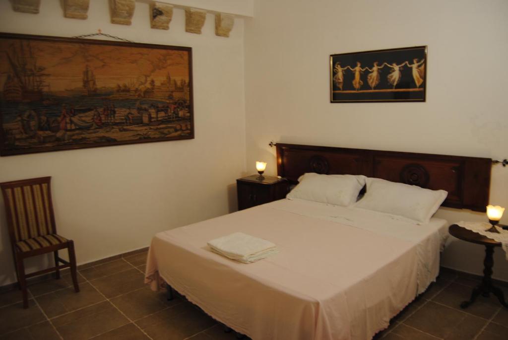 A bed or beds in a room at B & B Palazzo Maestro & Corte Maestro rooms