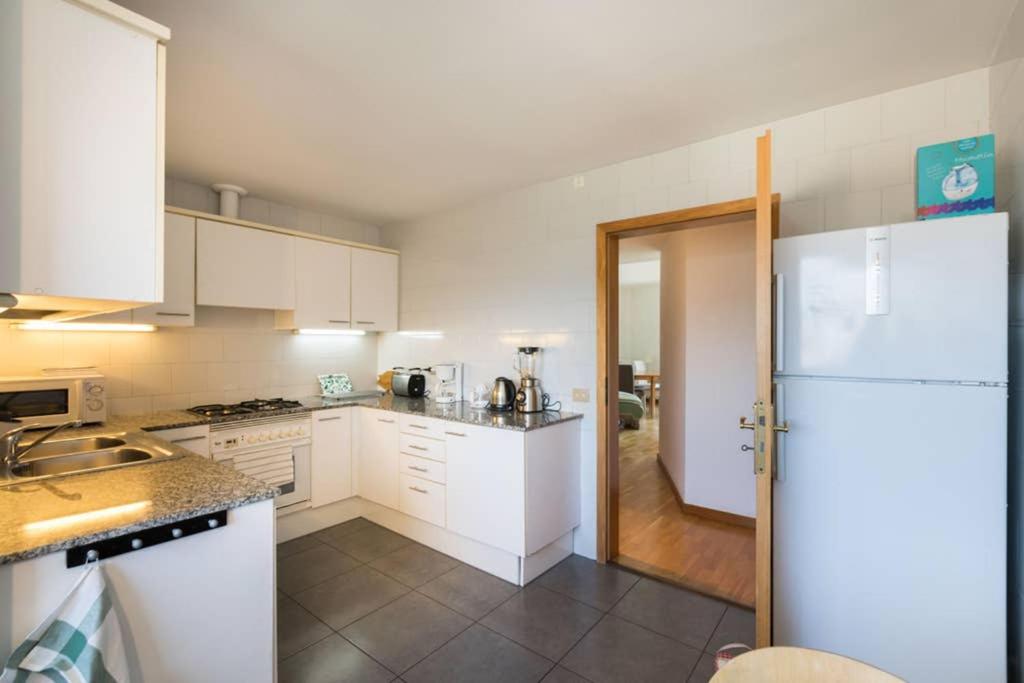 A kitchen or kitchenette at Sea views & city skyline