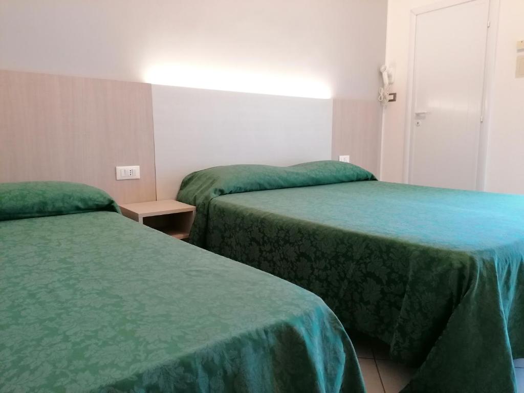 Postel nebo postele na pokoji v ubytování HOTEL ANDREA'S