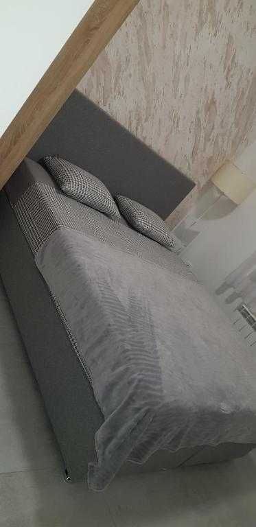 Posteľ alebo postele v izbe v ubytovaní Kabashi Apartment