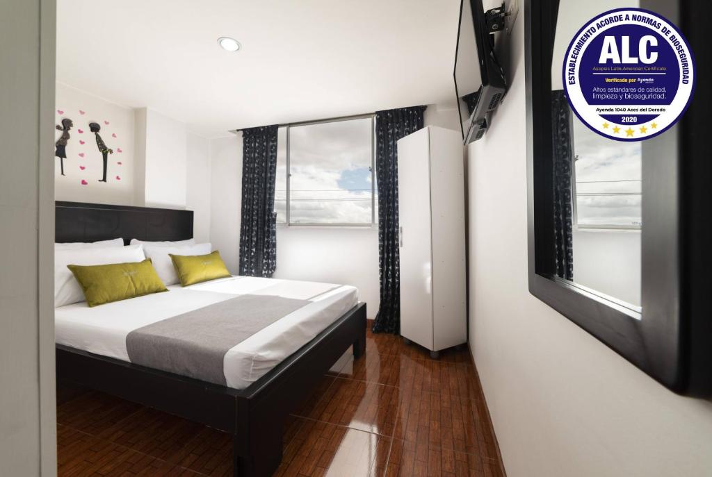 Postel nebo postele na pokoji v ubytování Hotel Dorado 100