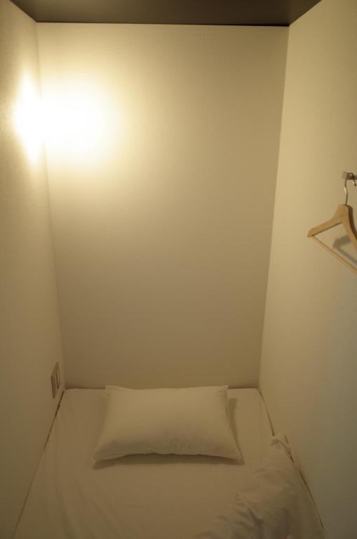 Postel nebo postele na pokoji v ubytování bnb+Atami Resort