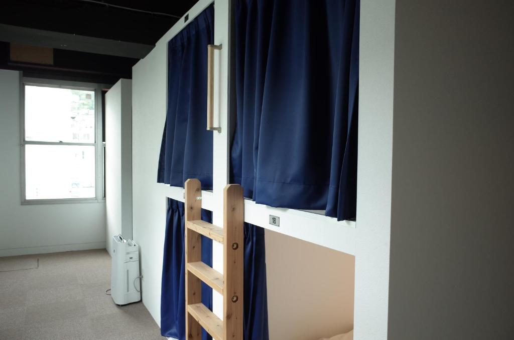 Postel nebo postele na pokoji v ubytování bnb+Atami Resort