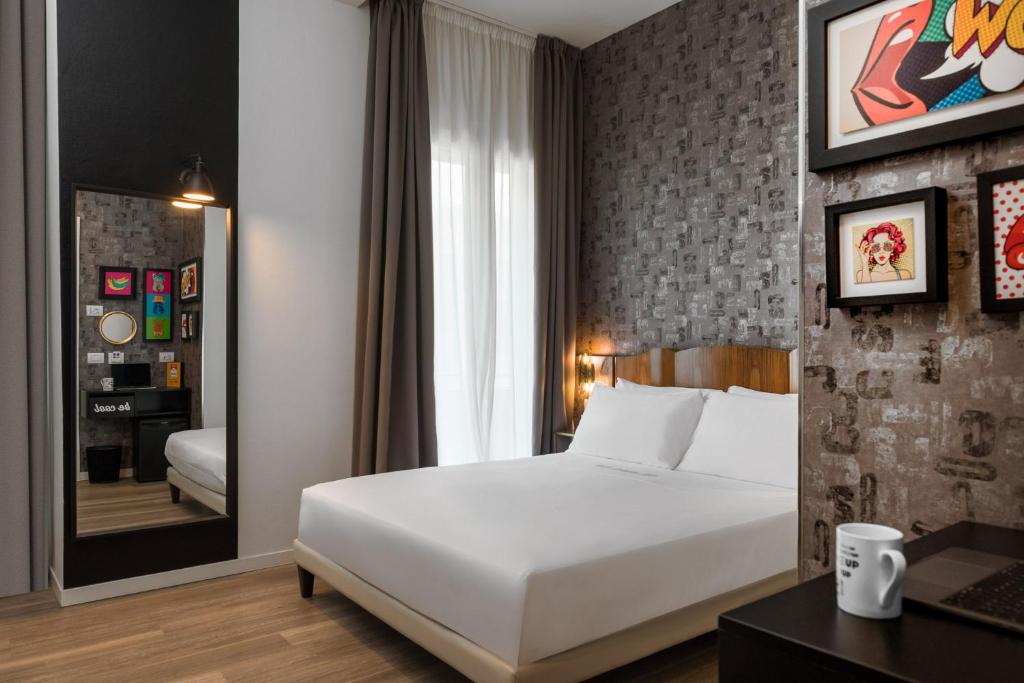 Postel nebo postele na pokoji v ubytování Up Hotel