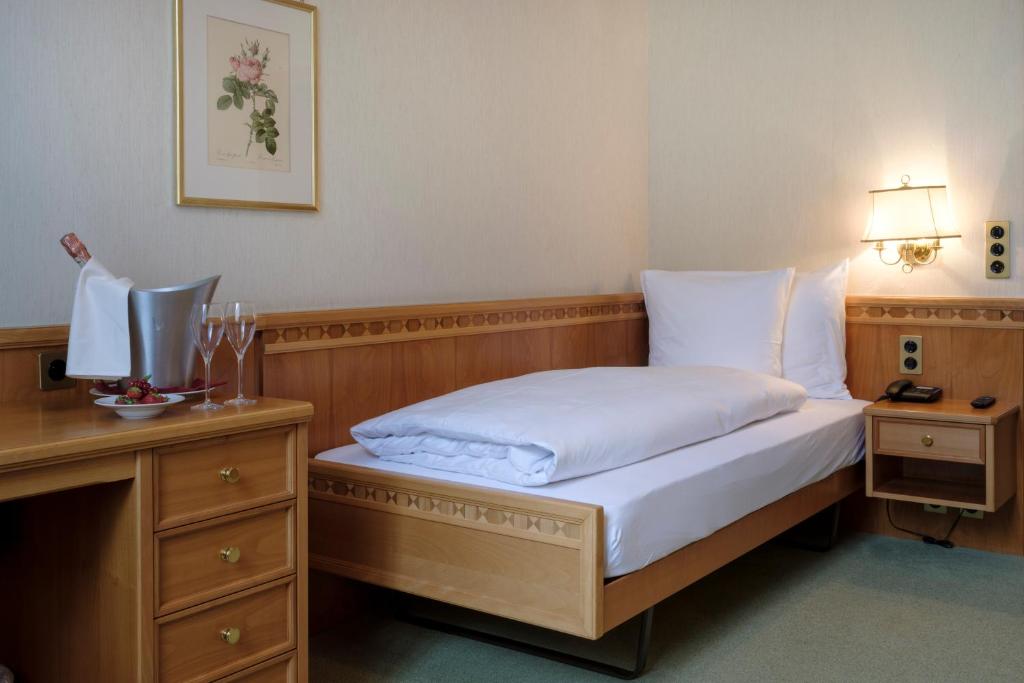 Postel nebo postele na pokoji v ubytování Hotel Le Prese