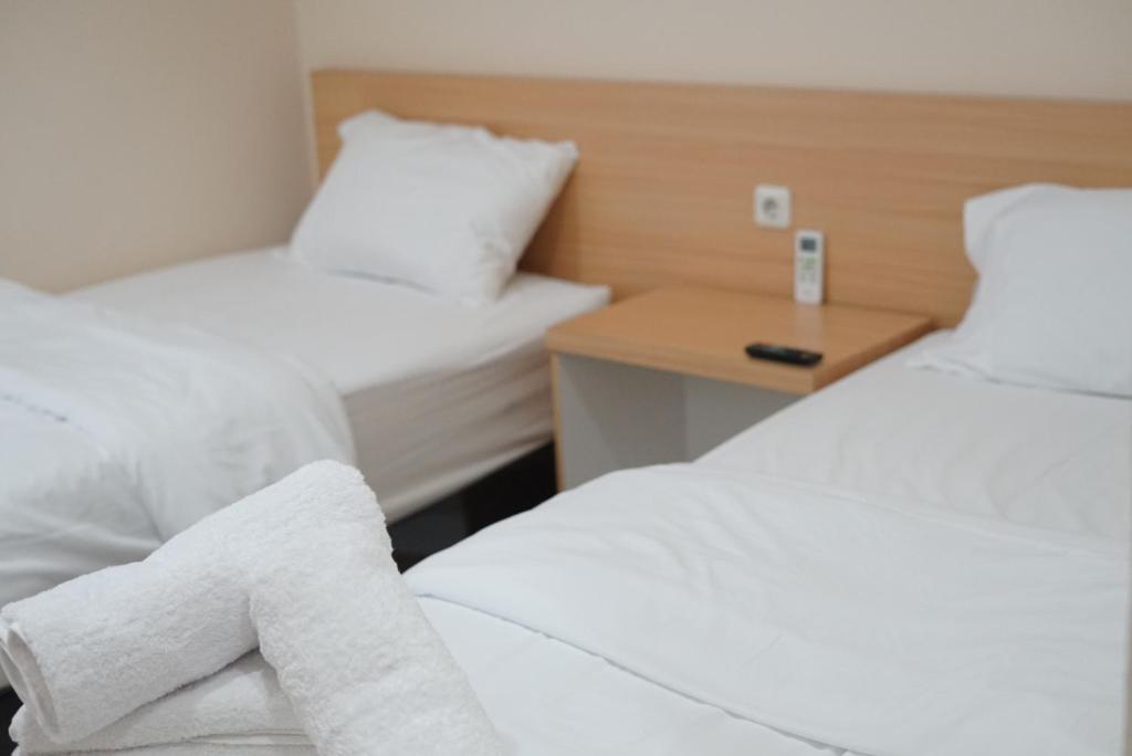 Кровать или кровати в номере Gold Line Guest House