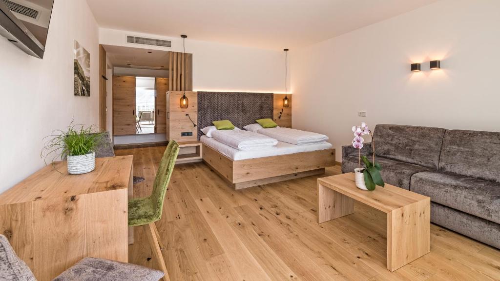 Postel nebo postele na pokoji v ubytování Hotel Garni Sonngart