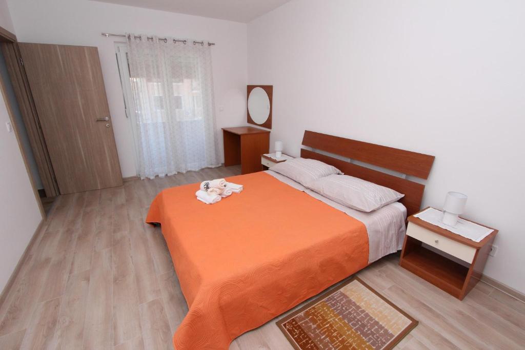 Postel nebo postele na pokoji v ubytování Apartments Eni