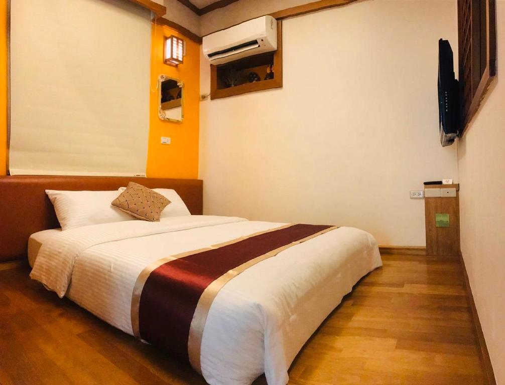 Postel nebo postele na pokoji v ubytování Purple Shell Homestay
