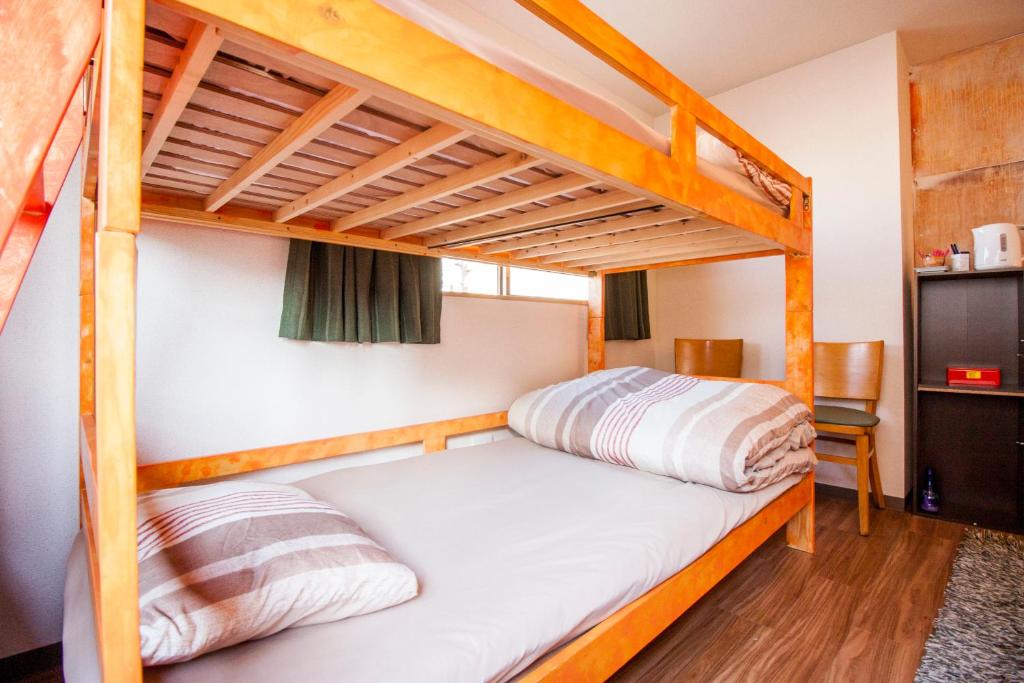 Postel nebo postele na pokoji v ubytování DEER Hostel OSAKA NAMBA