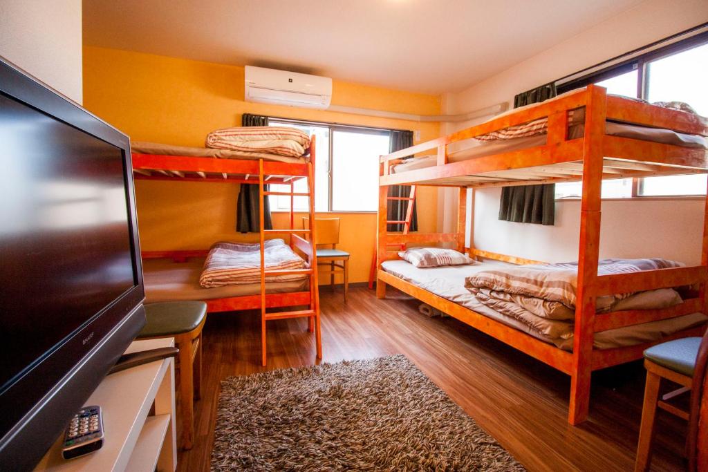 Postel nebo postele na pokoji v ubytování DEER Hostel OSAKA NAMBA