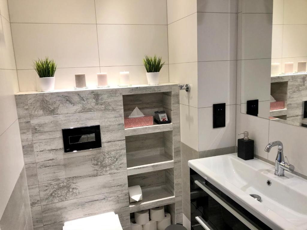 Kúpeľňa v ubytovaní Apartament Opieszyn 16