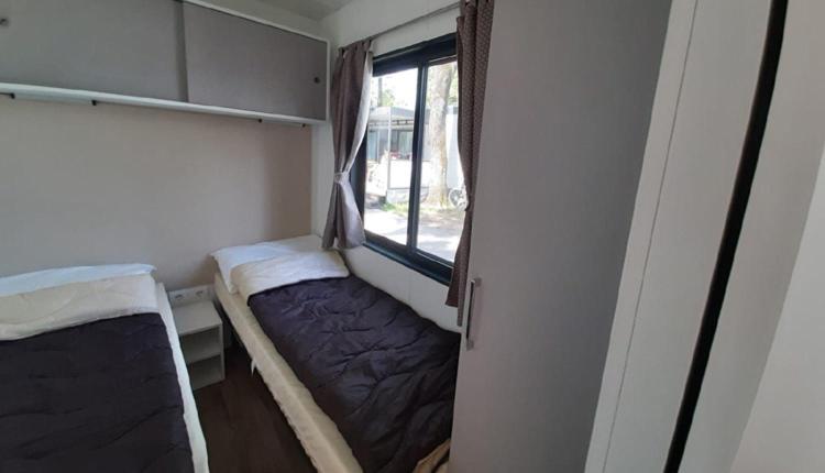 Postel nebo postele na pokoji v ubytování Casa Mobile - Spiaggia e Mare Holiday Park