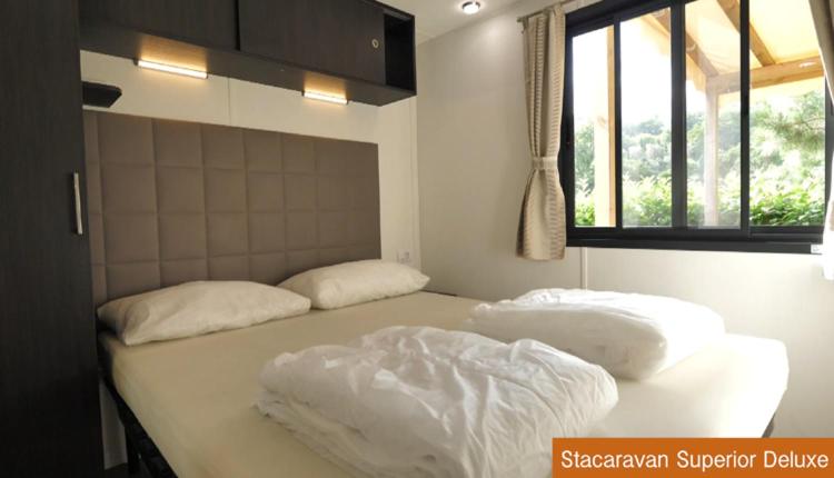 Postel nebo postele na pokoji v ubytování Casa Mobile - Spiaggia e Mare Holiday Park