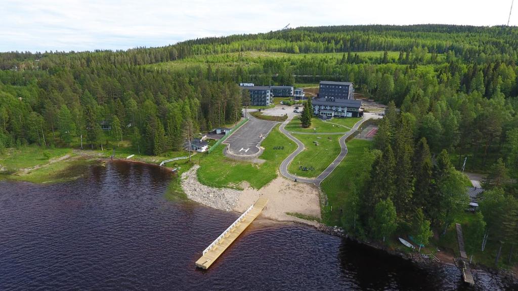 an aerial view of a resort in the middle of a lake at Aateli Lakeside Chalets - former Vuokatti Suites in Vuokatti