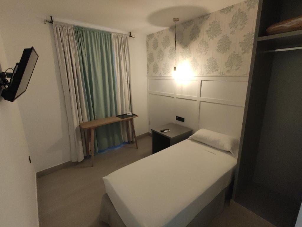 Postel nebo postele na pokoji v ubytování Hotel Cedran