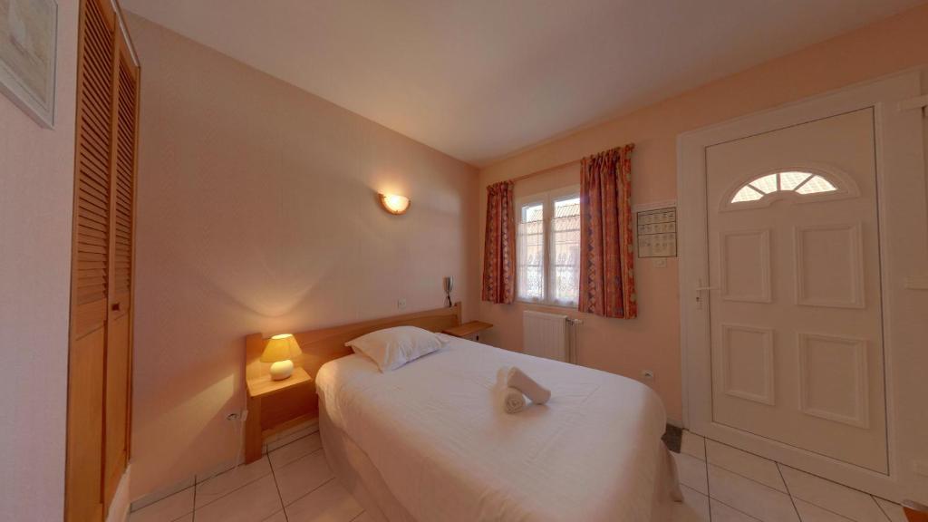 Postel nebo postele na pokoji v ubytování LOGIS - Hôtel & restaurant "L'envie des mets"